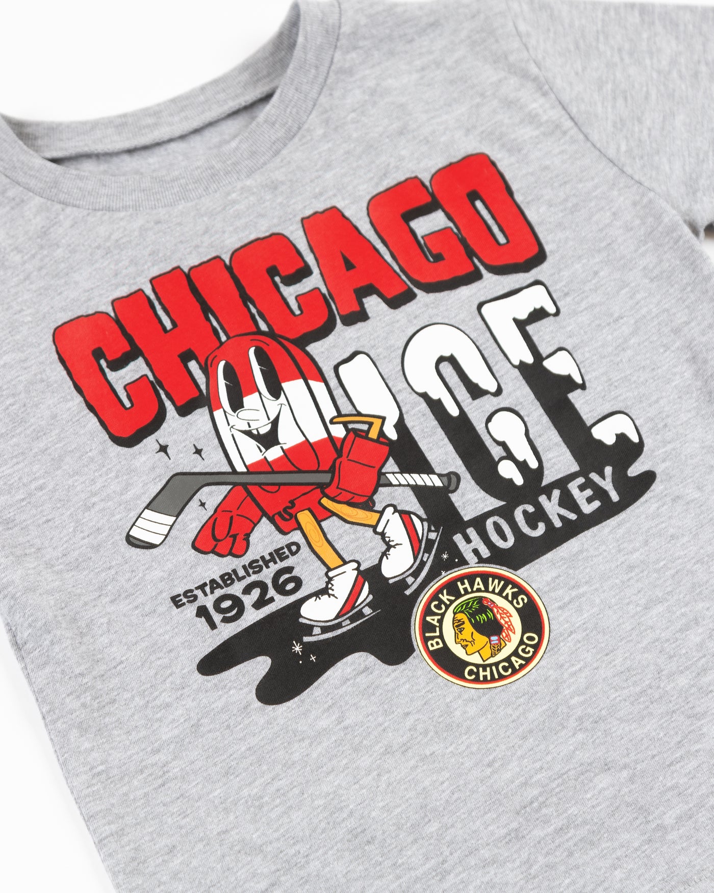 heather grey toddler Mitchell & Ness tee with ice pop animated hockey player character graphic on front - detail lay flat