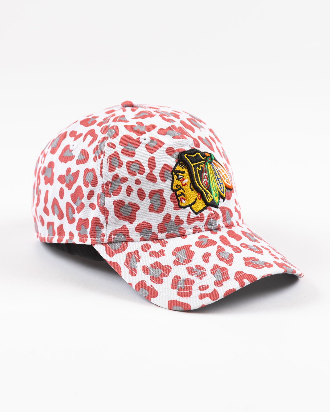 white New Era women's cap with all over pink cheetah print and Chicago Blackhawks primary logo on front - right angle lay flat