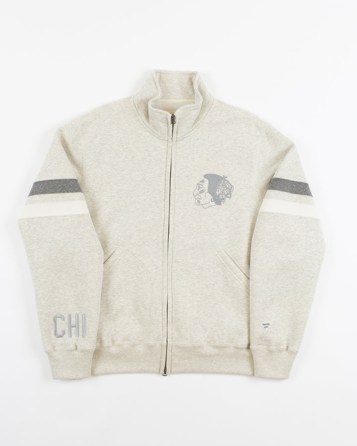 oatmeal full zip Todd Snyder New York jacket in partnership with Fanatics with vintage logo on left chest, CHI embroidered on cuff and Blackhawks wordmark on back - front lay flat