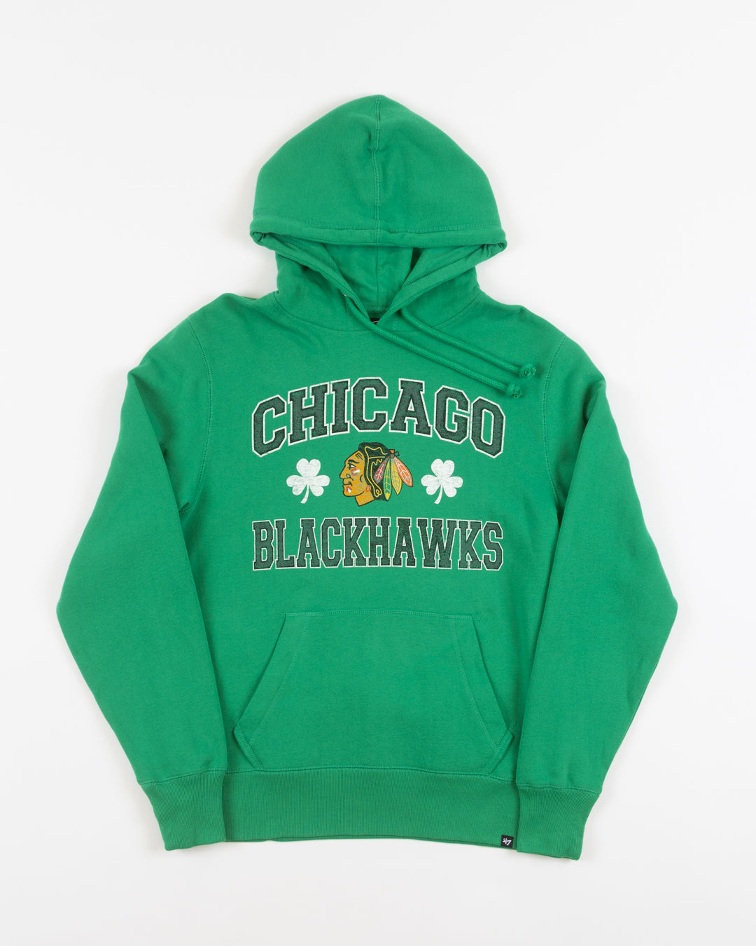 green St. Patrick's Day themed '47 brand hoodie with Chicago Blackhawks wordmark and primary logo with shamrocks - front lay flat