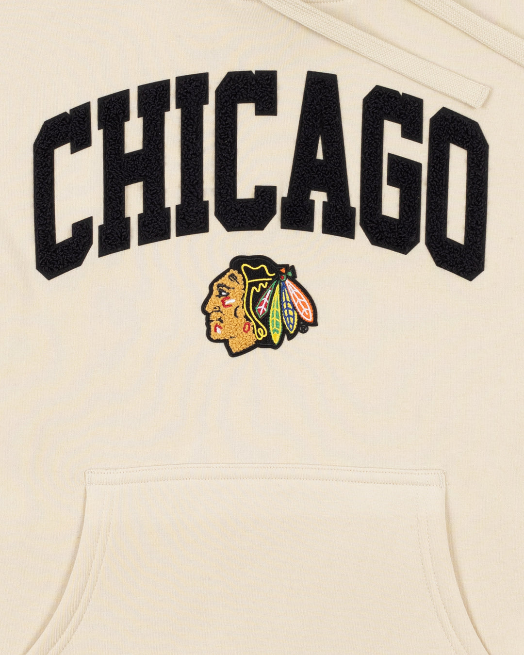 cream Sportiqe hoodie with Chicago wordmark and primary Chicago Blackhawks logo on front - front detail lay flat