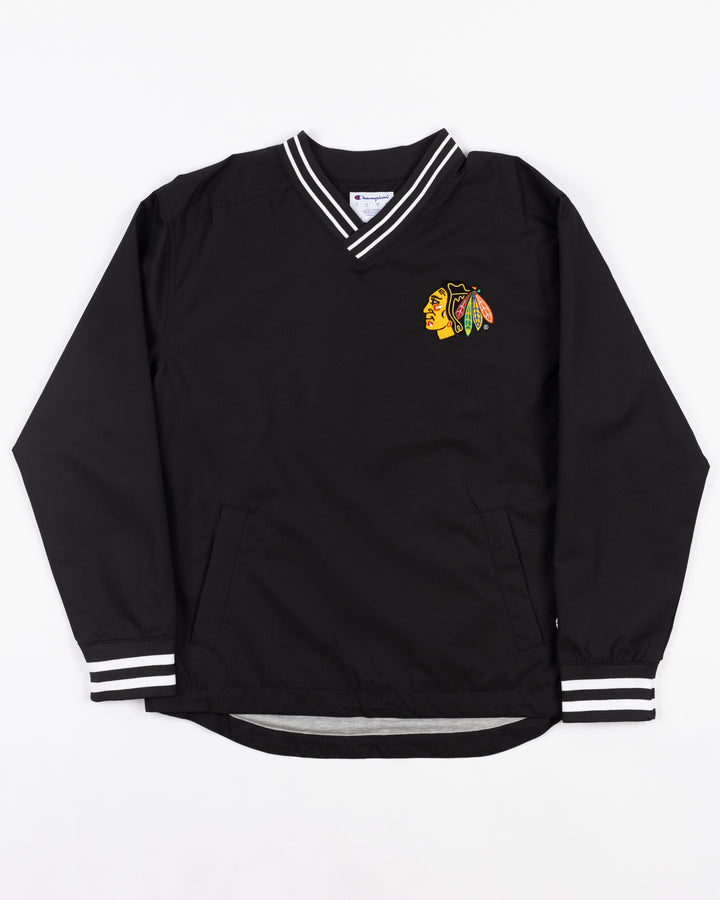 black Champion pullover sweater with Chicago Blackhawks primary logo on left chest and Blackhawks wordmark on back - front lay flat