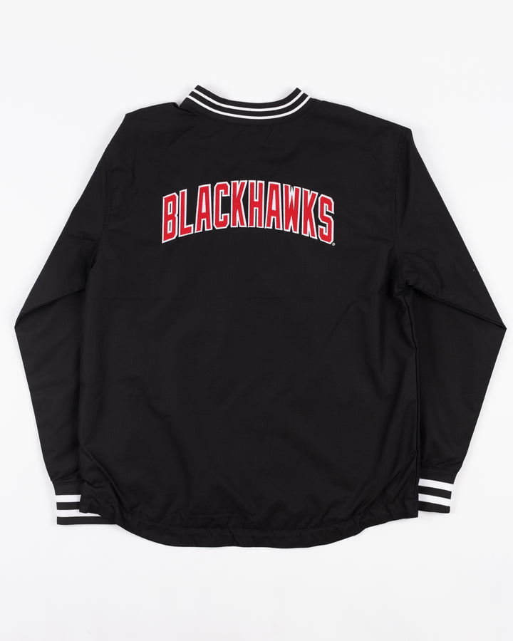 black Champion pullover sweater with Chicago Blackhawks primary logo on left chest and Blackhawks wordmark on back - back lay flat