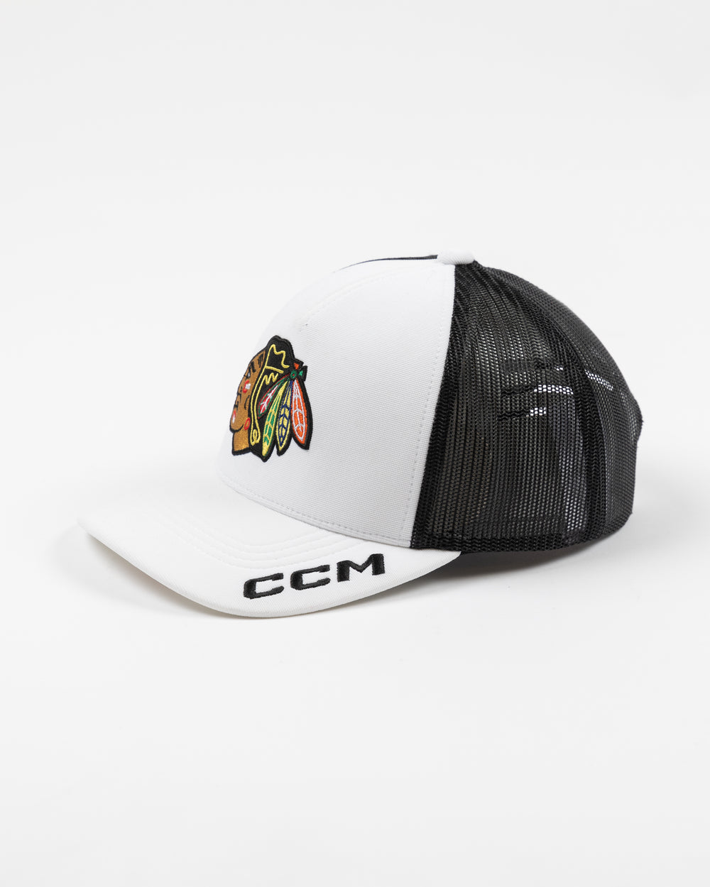 white and black CCM trucker cap with Chicago Blackhawks primary logo embroidered on front and CCM logo on brim - left angle lay flat