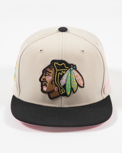 tan and black Mitchell & Ness fitted cap with embroidered Chicago Blackhawks primary logo on front with pink accents - front lay flat
