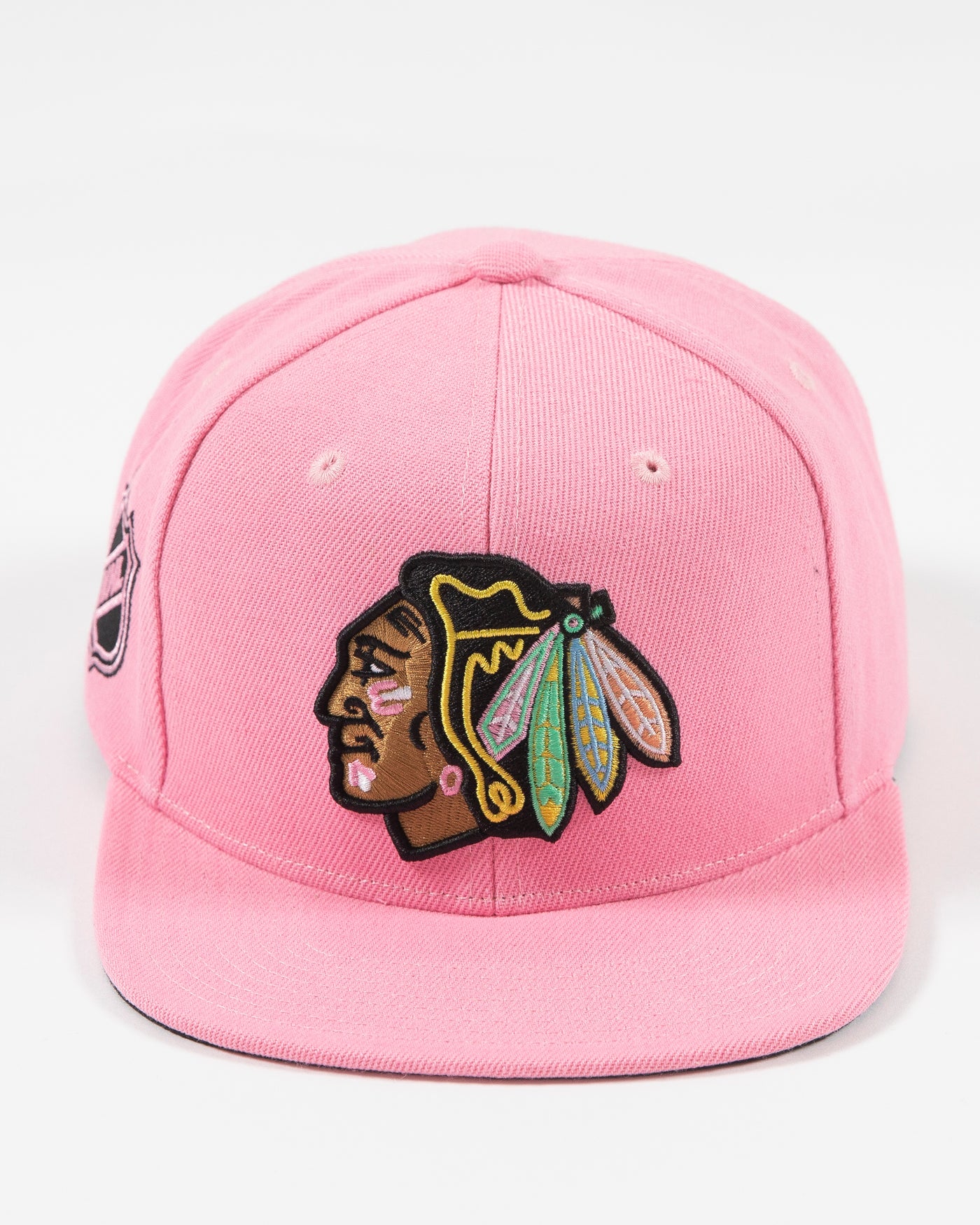 Mitchell & Ness pink snapback with Chicago Blackhawks primary logo embroidered on the front with pink accents - front lay flat