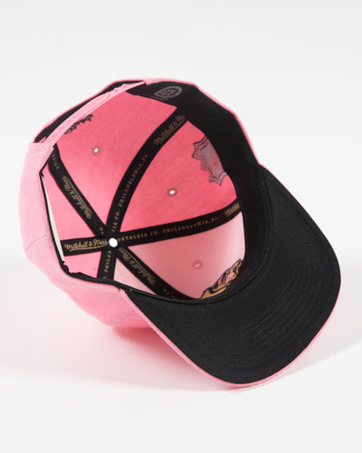 Mitchell & Ness pink snapback with Chicago Blackhawks primary logo embroidered on the front with pink accents - under brim detail lay flat