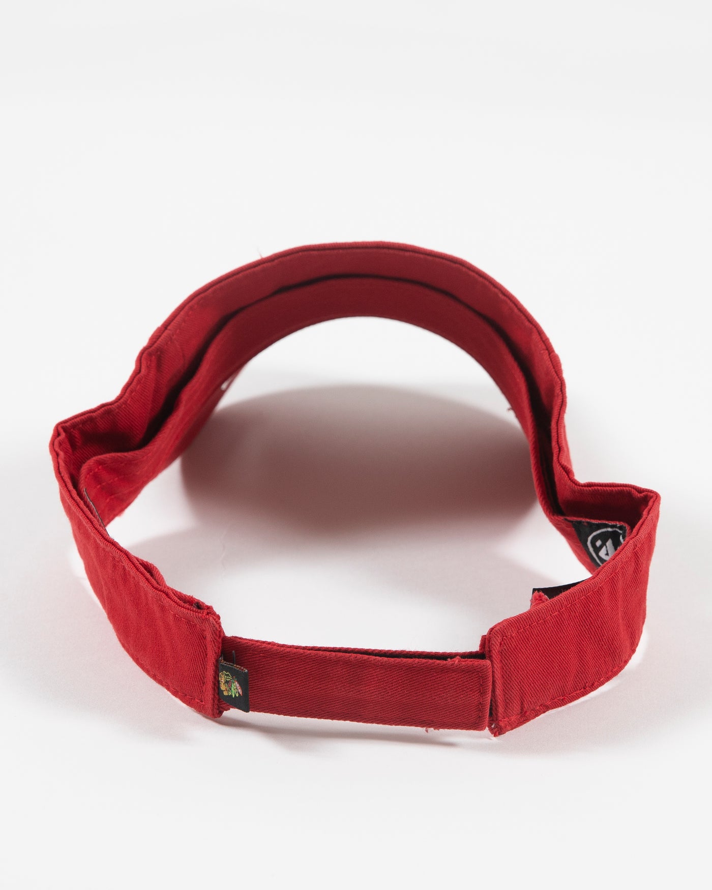 red '47 brand visor with Chicago Blackhawks primary logo embroidered on front - back lay flat