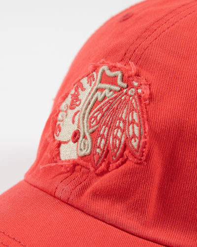 orange '47 brand adjustable cap with Chicago Blackhawks tonal primary logo with distress detailing - detail lay flat
