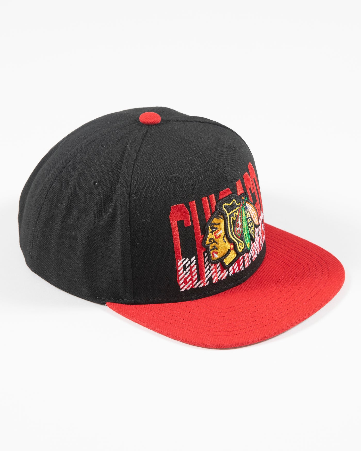 Mitchell & Ness Chicago Blackhawks snapback with red brim and primary logo with cross check wordmark embroidered on front panel - right angle lay flat