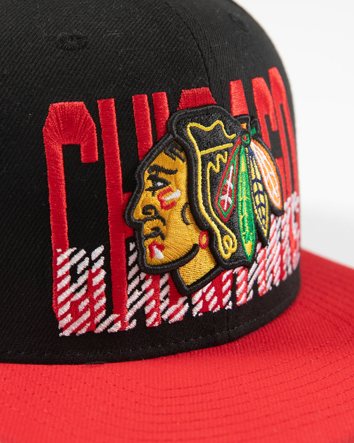 Mitchell & Ness Chicago Blackhawks snapback with red brim and primary logo with cross check wordmark embroidered on front panel - detail lay flat