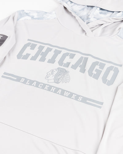 grey Colosseum operation hat trick long sleeve with hood with Chicago Blackhawks primary logo and wordmark graphic and patches on sleeves - detail  lay flat