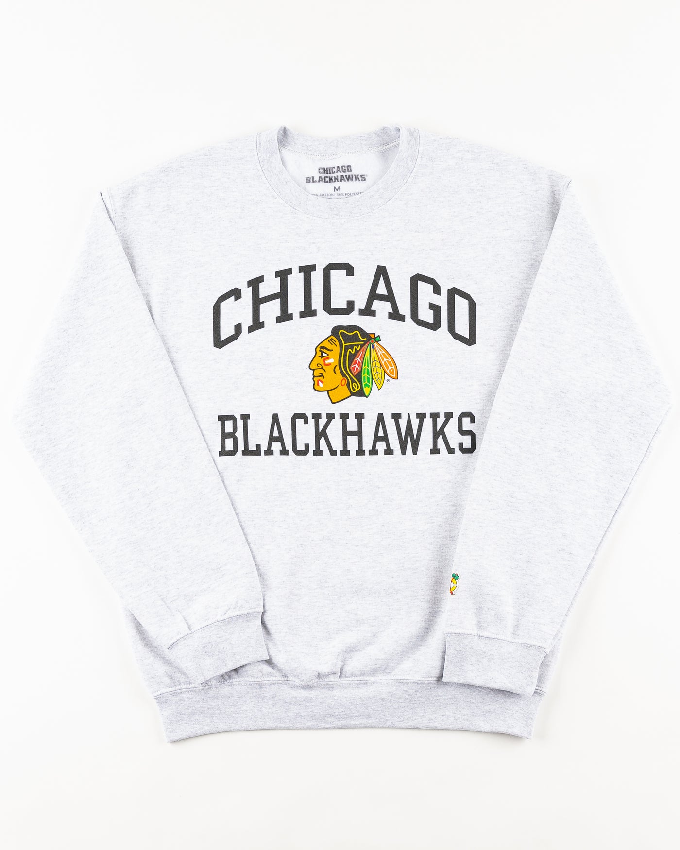 grey Chicago Blackhawks crewneck with wordmark and primary logo on chest and secondary logo on left wrist - front lay flat