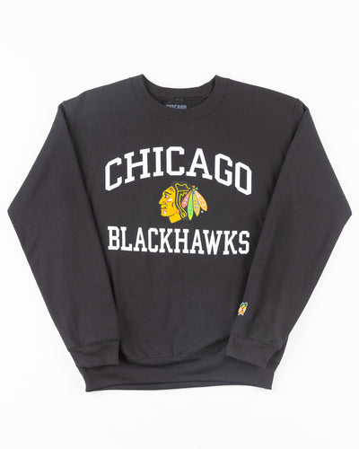 black Chicago Blackhawks crewneck with wordmark and primary logo on chest and secondary logo on left wrist - front lay flat