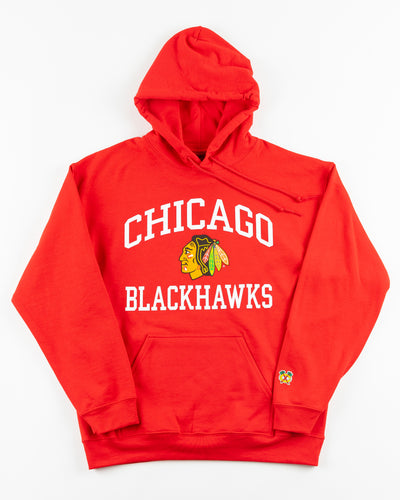 red Chicago Blackhawks hoodie with wordmark and primary logo on chest and secondary logo on left wrist - front lay flat