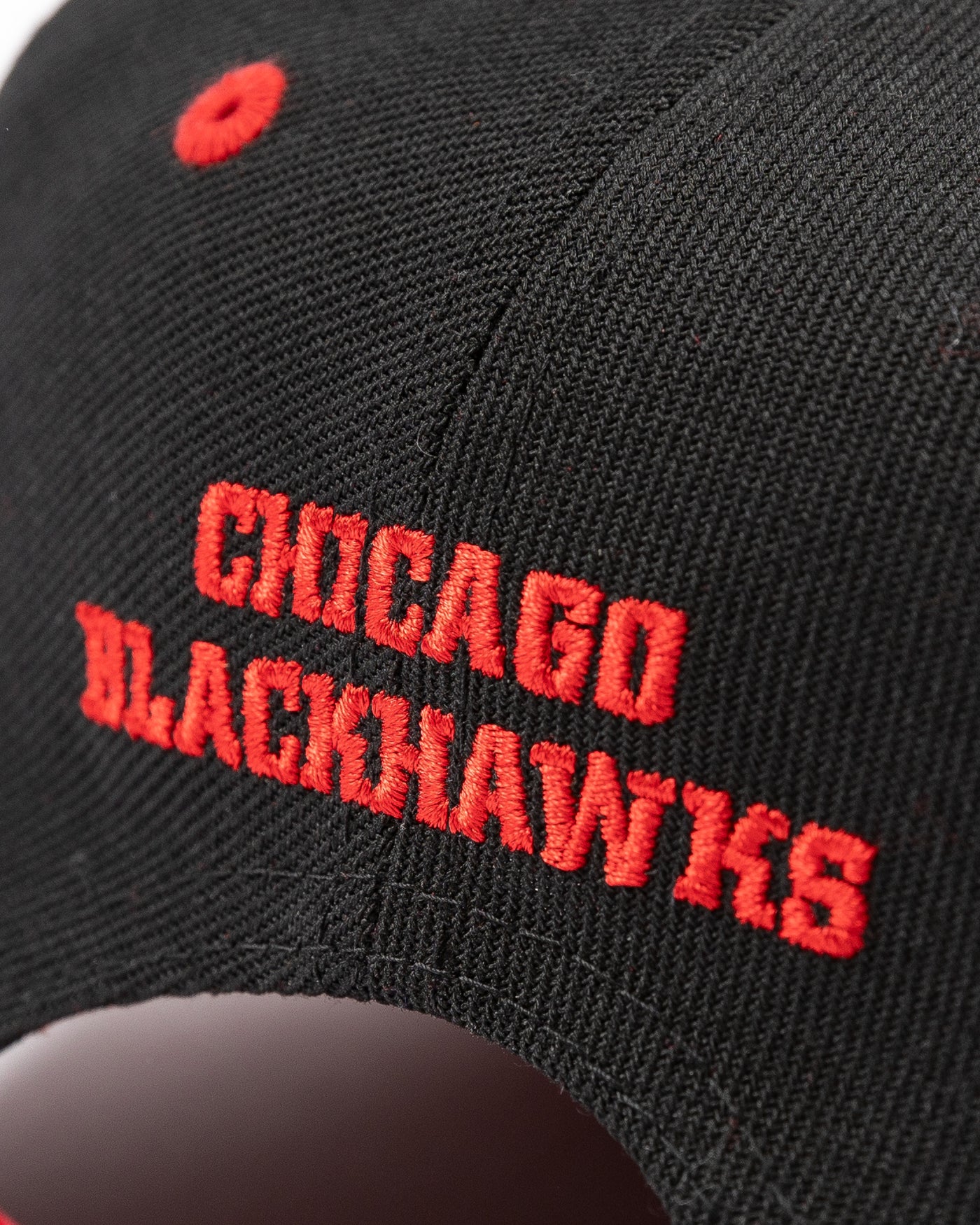 two tone black and red youth snapback cap with Chicago Blackhawks tonal primary logo on front and red wordmark on back - alt detail lay flat