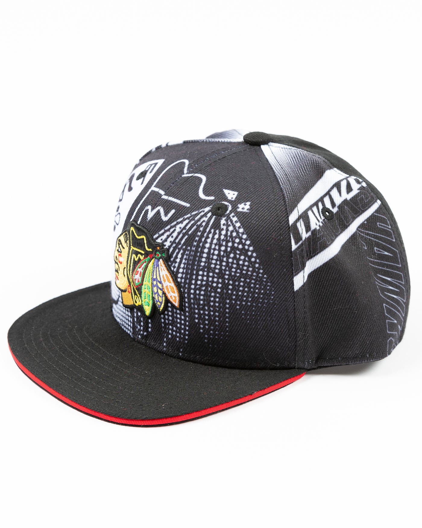 black and white all over print youth snapback cap with Chicago Blackhawks primary logo embroidered on front - left angle lay flat
