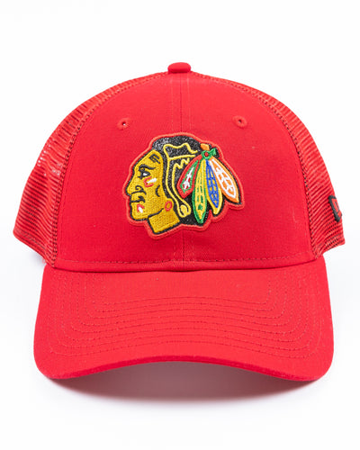 red New Era ladies adjustable trucker style cap with sparkly Chicago Blackhawks primary logo embroidered on front - front lay flat