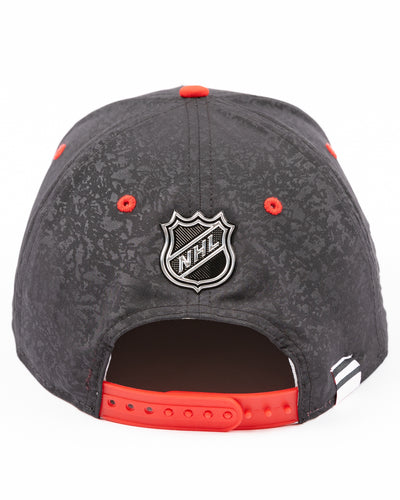 two tone black and red debossed Fanatics snapback cap with Chicago wordmark on front and Chicago Blackhawks primary logo embroidered on right side - back lay flat