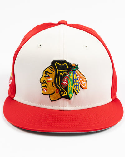two tone red and white satin fitted New Era 59FIFTY cap with Chicago Blackhawks primary logo on front, secondary logo patch on right side and wordmark on back - front lay flat