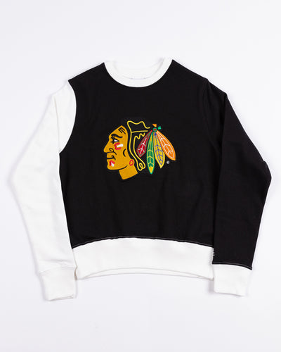 black and white color block Champion women's crewneck with Chicago Blackhawks primary logo embroidered on front - front lay flat