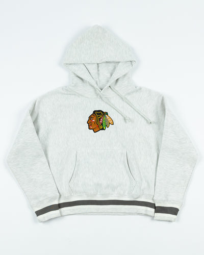 silver Champion women's reverse weave hoodie with Chicago Blackhawks primary logo embroidered on front - front lay flat
