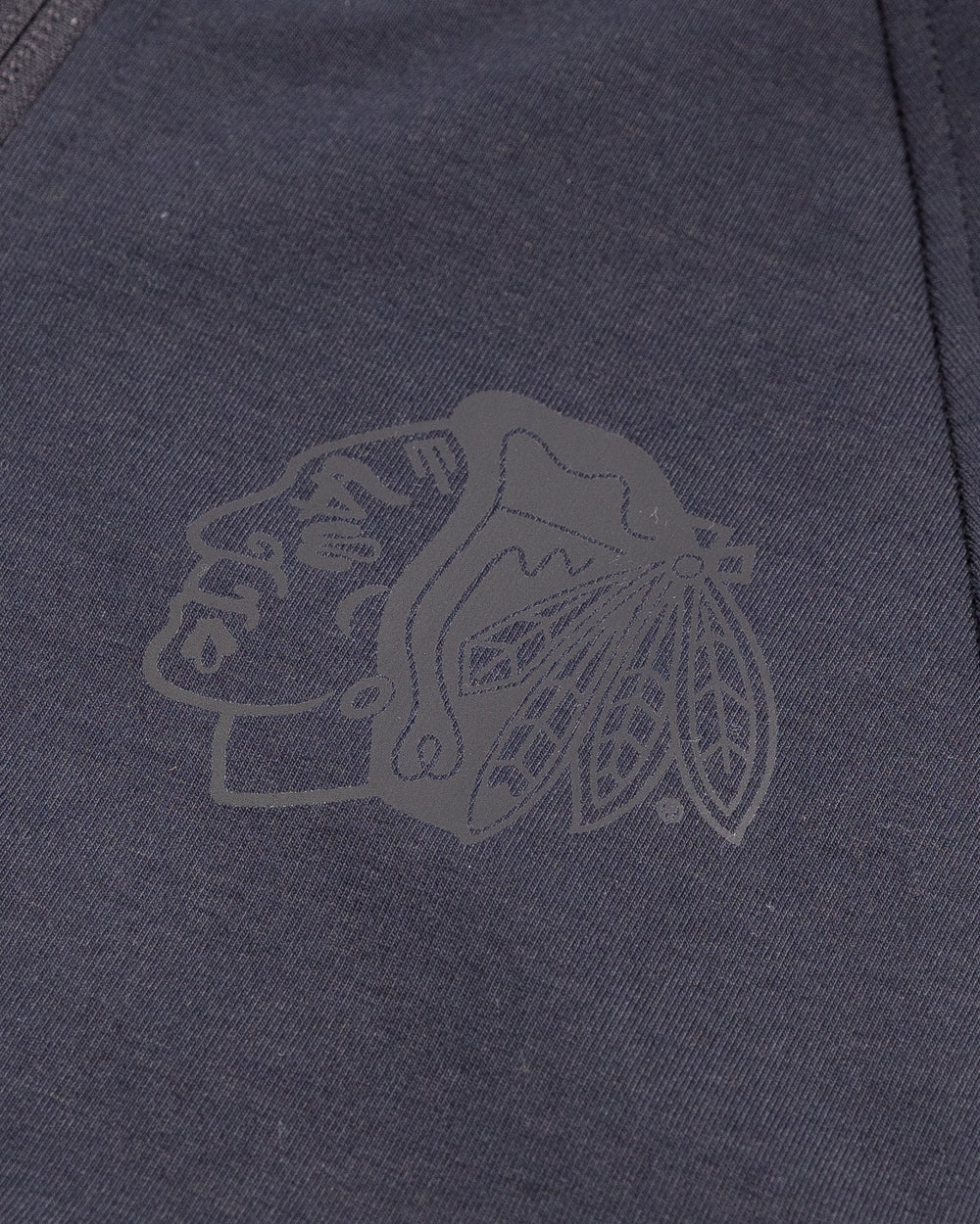 black lululemon full zip hoodie with tonal Chicago Blackhawks primary logo printed on left chest - detail lay flat