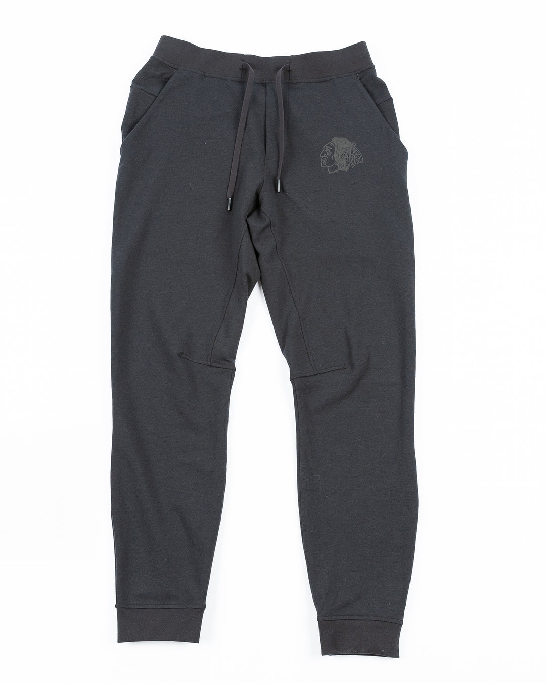 black lululemon joggers with tonal Chicago Blackhawks primary logo printed on left leg - front lay flat
