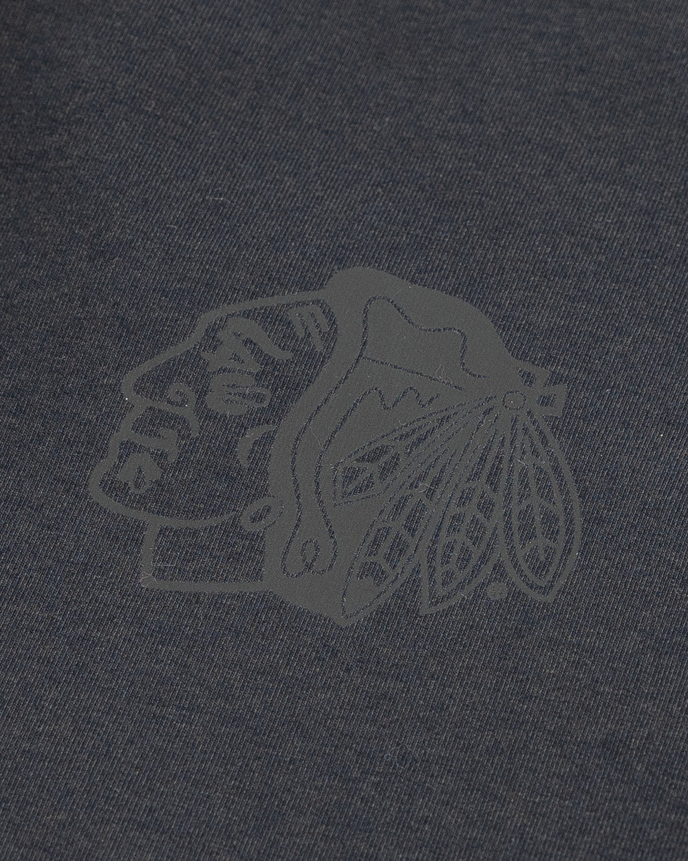 black lululemon joggers with tonal Chicago Blackhawks primary logo printed on left leg - detail lay flat