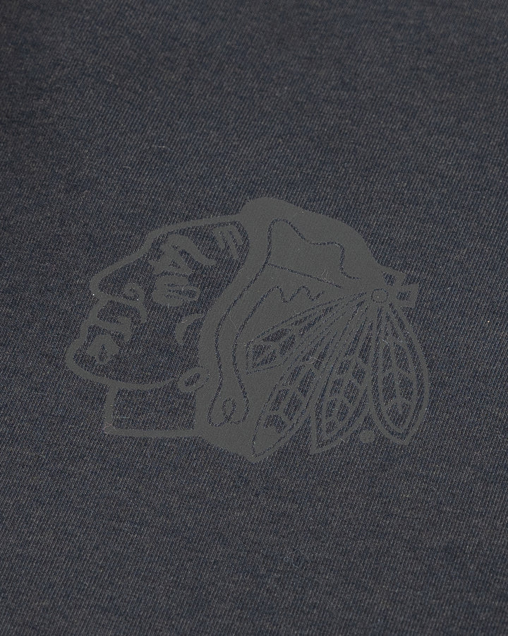 black lululemon joggers with tonal Chicago Blackhawks primary logo printed on left leg - detail lay flat