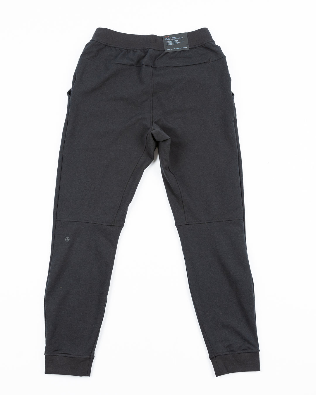 black lululemon joggers with tonal Chicago Blackhawks primary logo printed on left leg - back lay flat