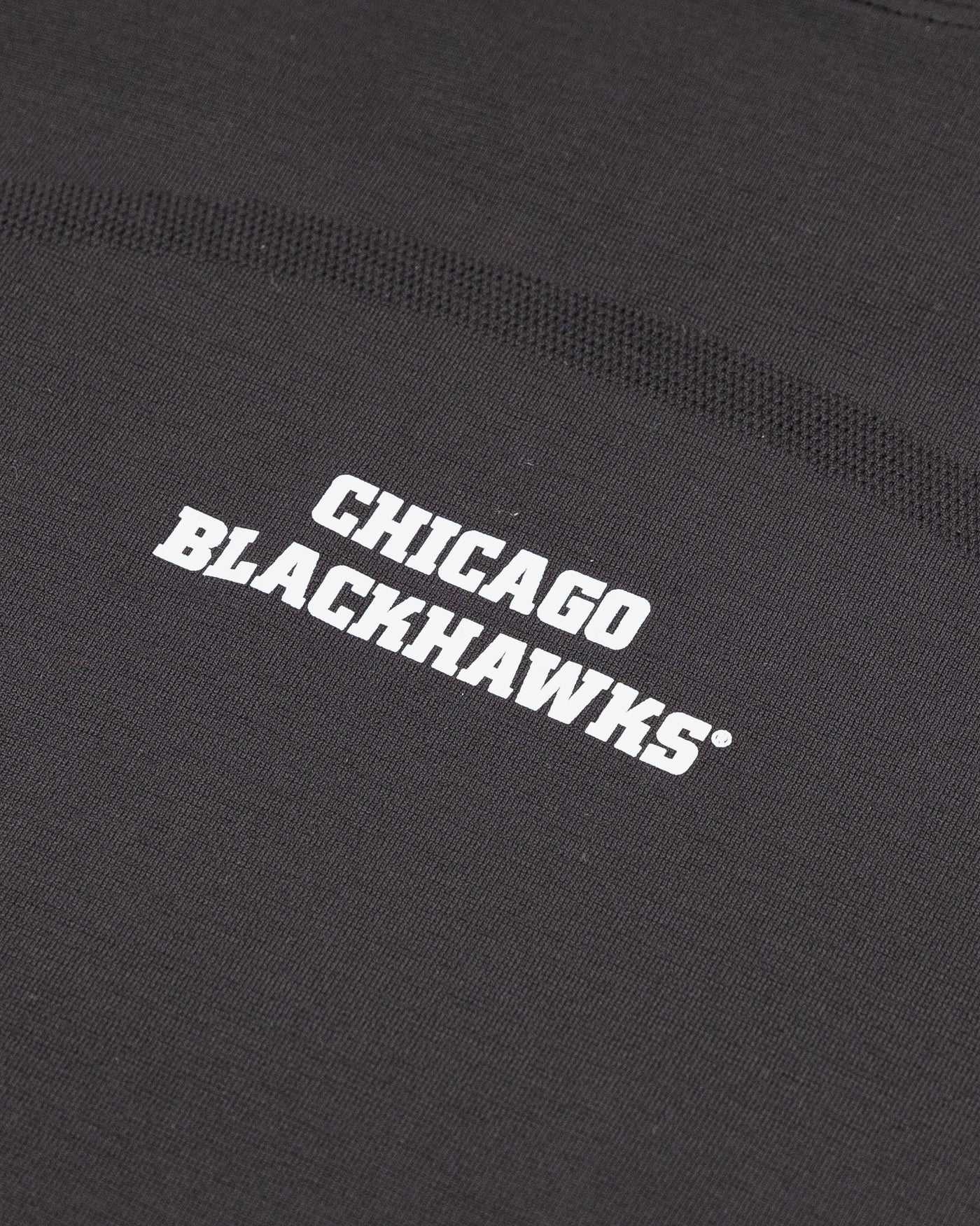 black ladies lululemon long sleeve with Chicago Blackhawks wordmark on chest - detail lay flat
