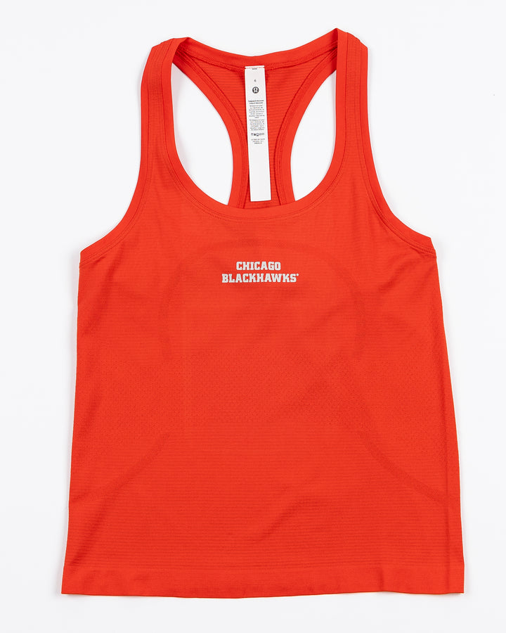 red lululemon women's tank with Chicago Blackhawks wordmark printed on front - front lay flat