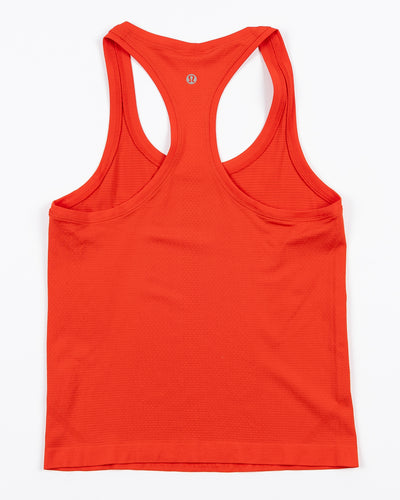 red lululemon women's tank with Chicago Blackhawks wordmark printed on front - back lay flat