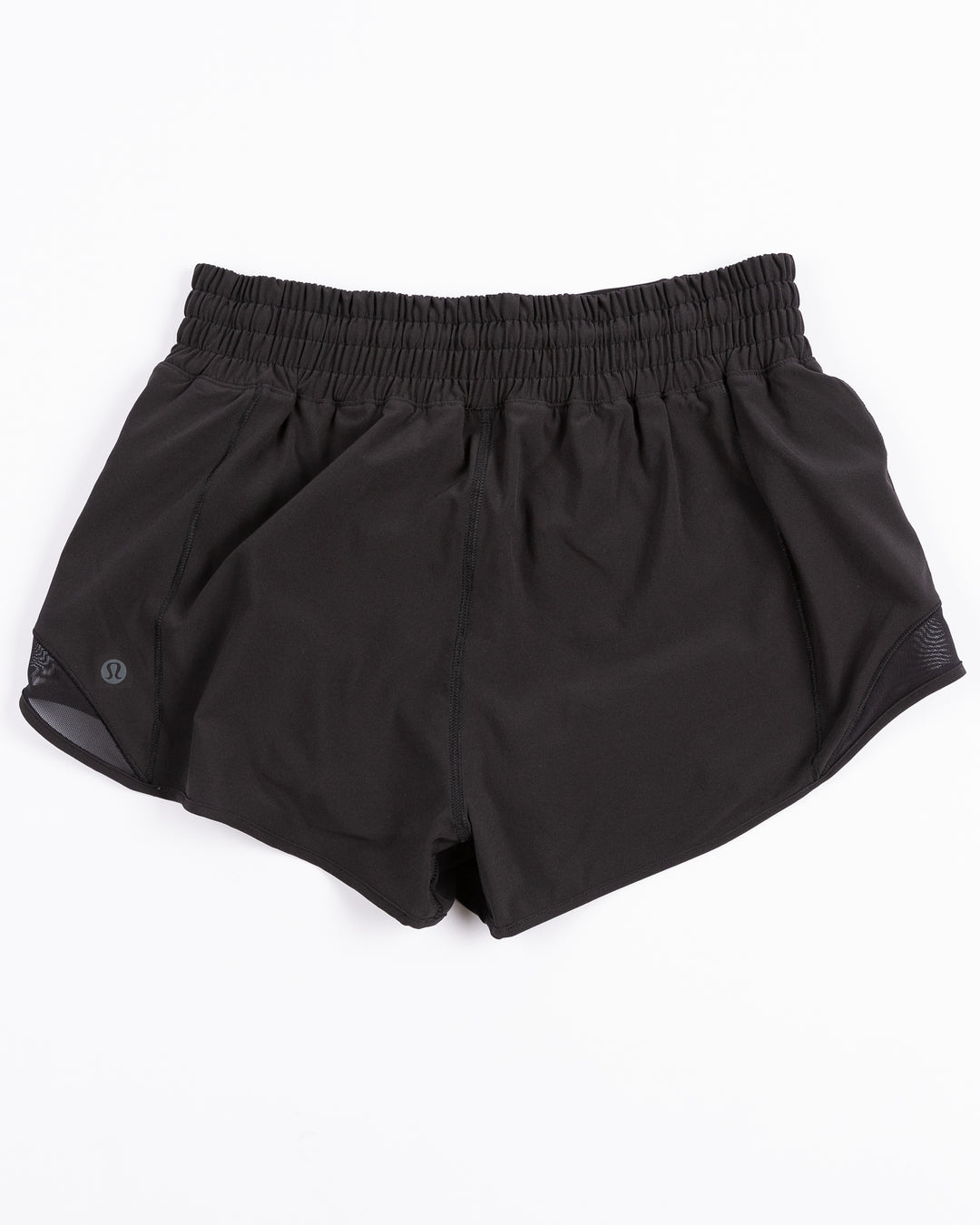 black lululemon women's running shorts with tonal Chicago Blackhawks primary logo printed on left leg - back lay flat