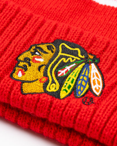 red and white stripe Zoozatz women's kit beanie with pom and Chicago Blackhawks primary logo embroidered on front - detail lay flat