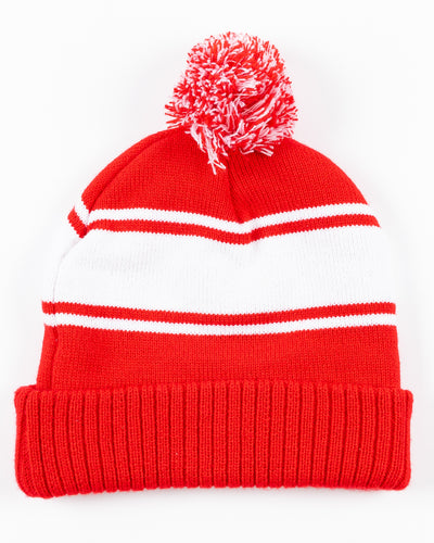 red and white stripe Zoozatz women's kit beanie with pom and Chicago Blackhawks primary logo embroidered on front - back lay flat