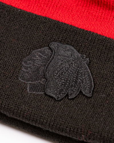 two tone youth knit beanie with Chicago Blackhawks tonal primary logo embroidered on cuff and wordmark embroidered on back - detail lay flat