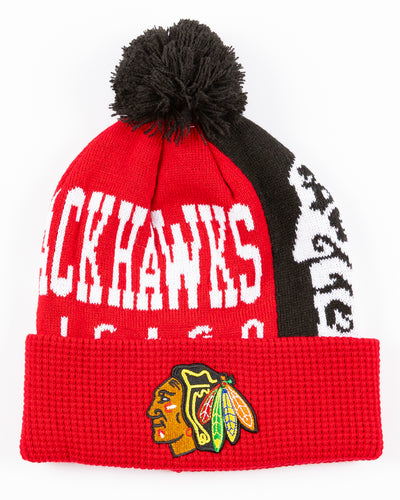 red youth knit beanie with Chicago Blackhawks graphic across front and embroidered primary logo on waffle knit cuff and black pom on top - front lay flat
