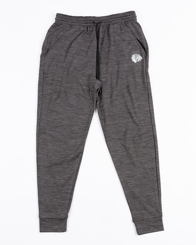 grey Fanatics Authentic Pro jogger sweatpants with tonal Chicago Blackhawks primary logo on left pocket - front lay flat