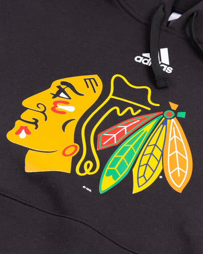 black adidas hoodie with Chicago Blackhawks primary logo on chest - detail lay flat