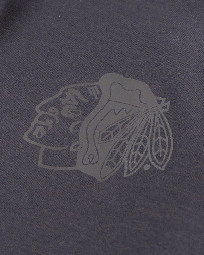 black lululemon hoodie with tonal Chicago Blackhawks primary logo printed on left chest - detail lay flat