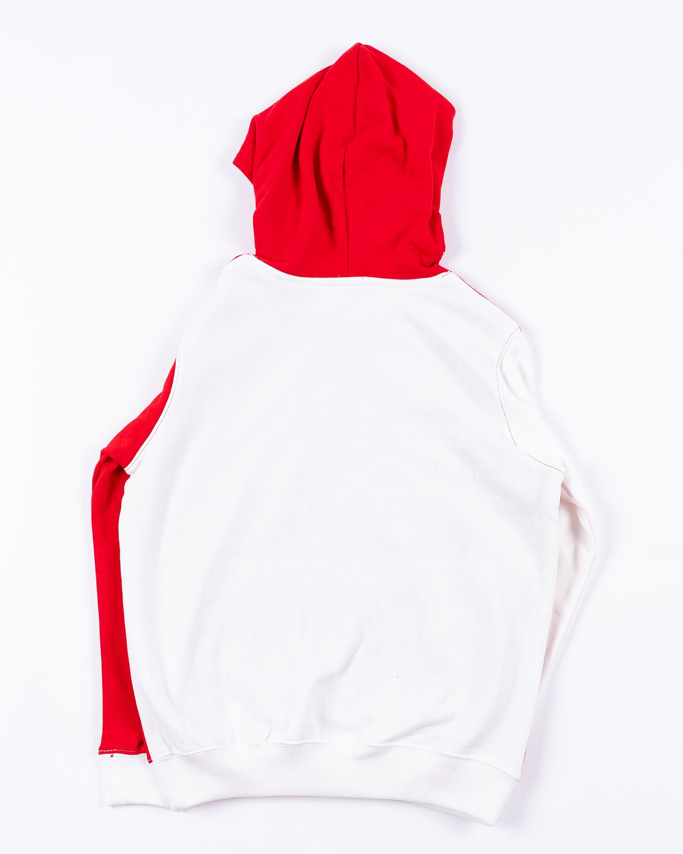 youth Champion hoodie with color block red and white design with Chicago Blackhawks wordmark on right sleeve and primary logo across chess - back lay flat