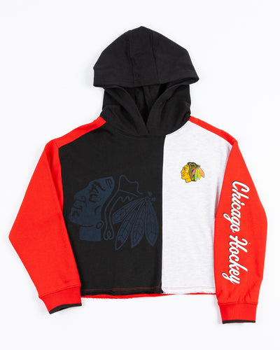 color blocked youth hoodie with Chicago Blackhawks primary logo design on front and wordmark down left arm - front lay flat