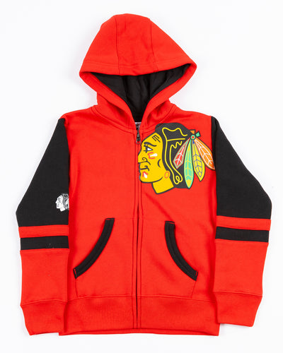 youth Champion zip up hoodie with red and black color block design and Chicago Blackhawks primary logos on left chest and right sleeve - front lay flat