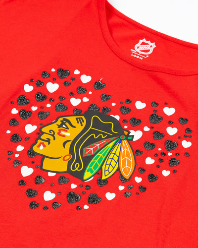 red youth tee with Chicago Blackhawks primary logo across chest surrounded by hearts - detail lay flat