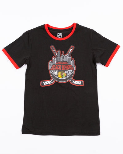 black youth tee with skyline inspired graphic with Chicago Blackhawks wordmark and primary logo across front - front lay flat