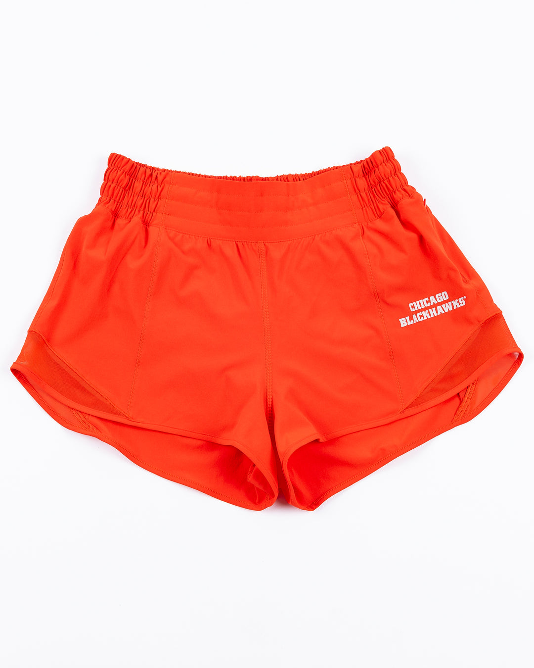 red lululemon shorts with Chicago Blackhawks wordmark on left leg - front lay flat