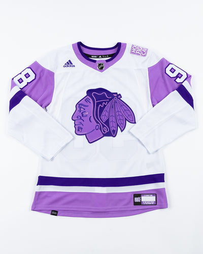 adidas hockey fights cancer Chicago Blackhawks official jersey with Connor Bedard name and number pro stitched - front lay flat 