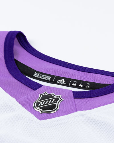 adidas hockey fights cancer Chicago Blackhawks official jersey with Connor Bedard name and number pro stitched - neckline detail lay flat 
